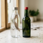 Aqua Cap vs Bev Cap: an aluminium water bottle closure beside an aluminium beverage closure